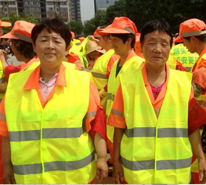 Child buy reflective vest for sanitation workers