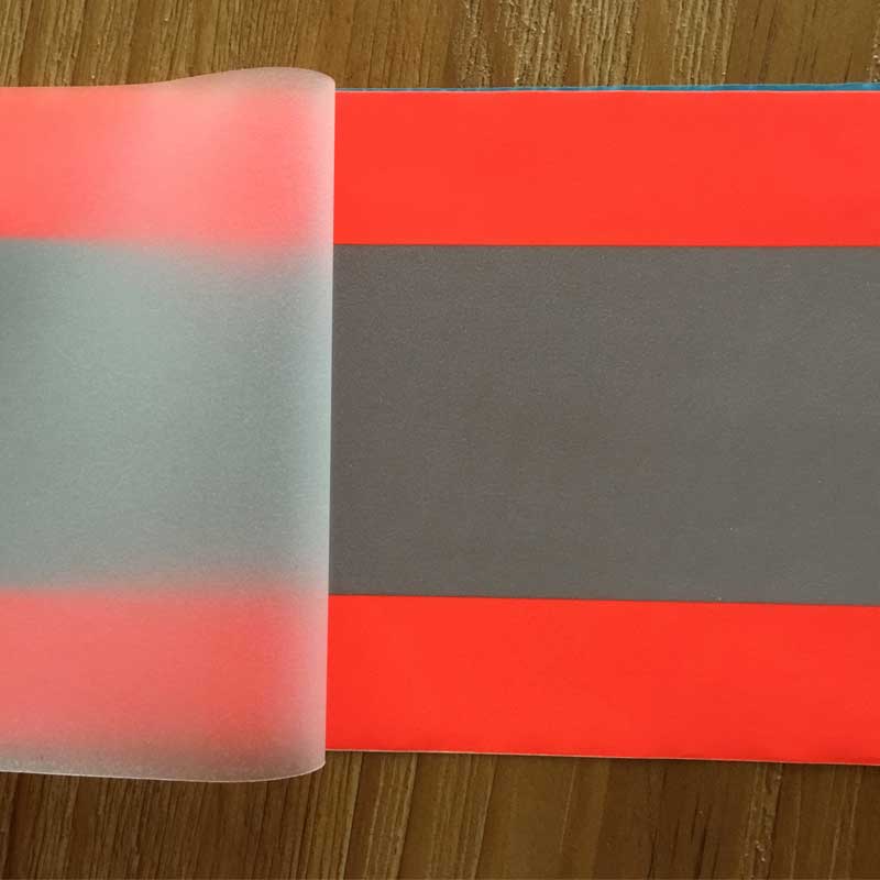 Reflective heat transfer vinyl orange-silver-orange