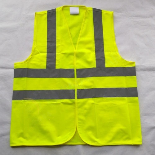 Rompi keselamatan dengan pita reflektif X di bagian belakang