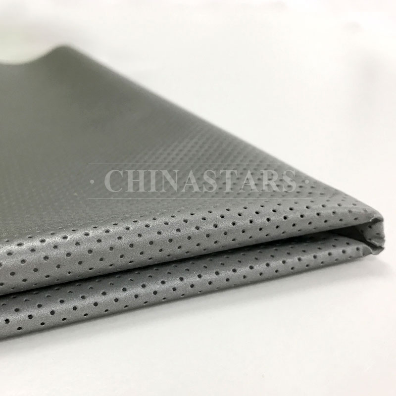 Perforated reflective stretch fabric for fashion clothing