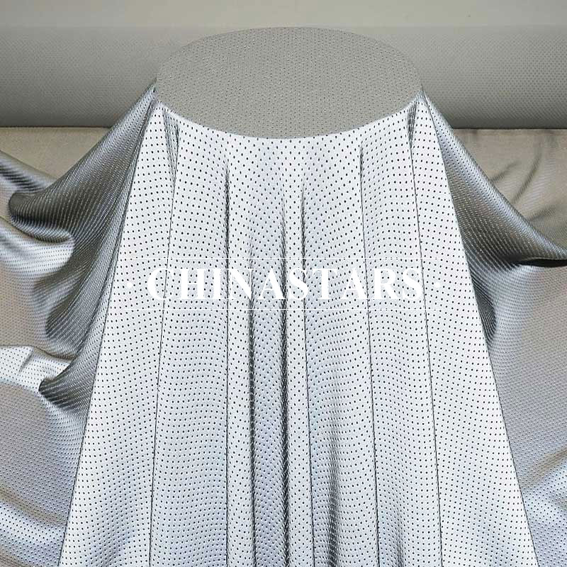 Perforated reflective stretch fabric for fashion clothing