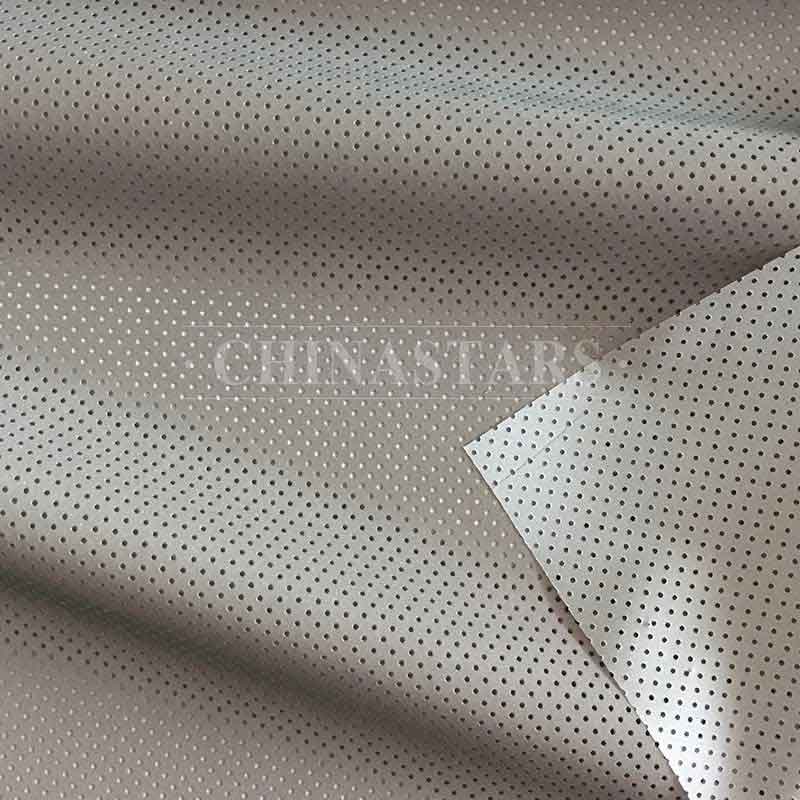 Perforated reflective fabric for outdoor clothing