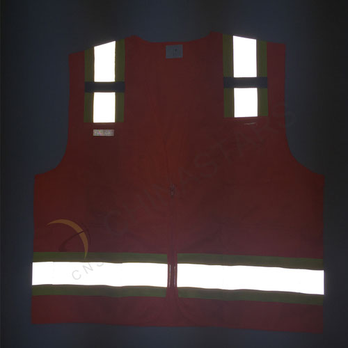 Orange reflective safety vest with warning tape