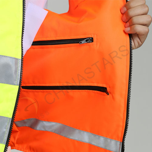 Reversible, double colored reflective safety vest