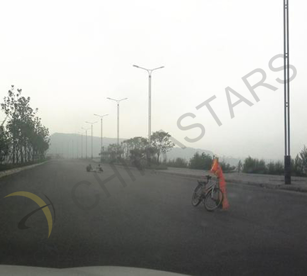 Road workers use safety vests for warning sign