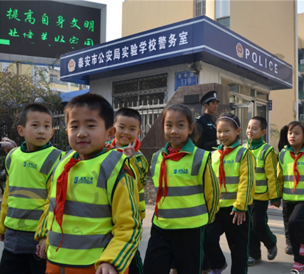Junior high school students wear reflective vests