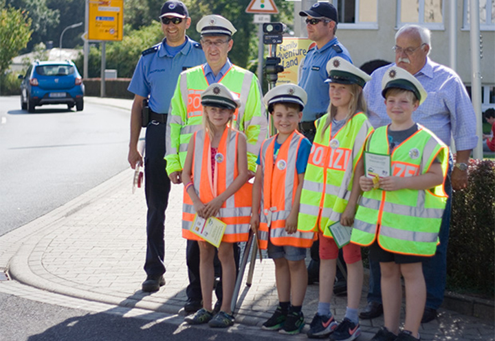 Children in safety vest to learn the traffic laws