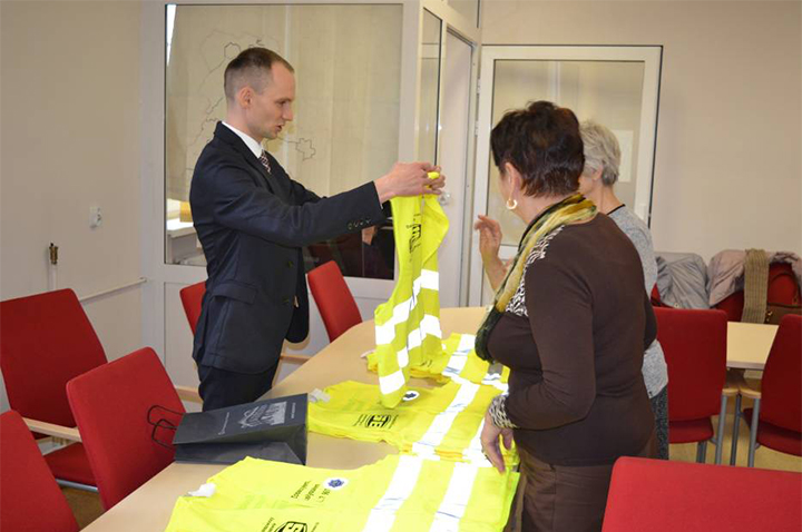Police hand out safety vest for Safety propaganda