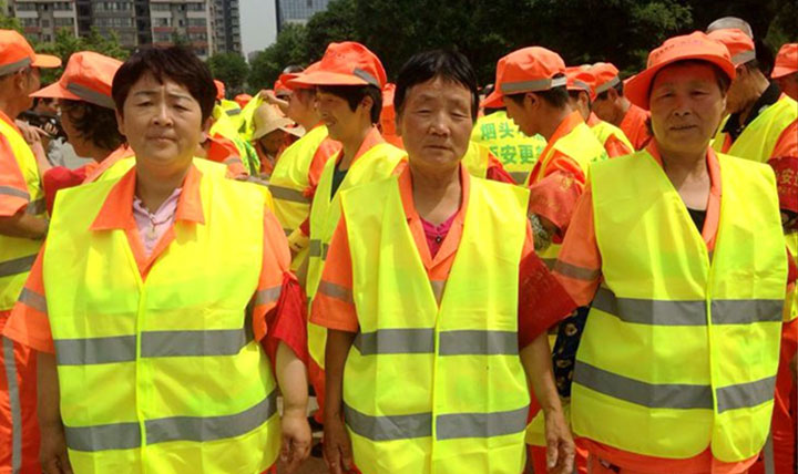 Child buy reflective vest for sanitation workers